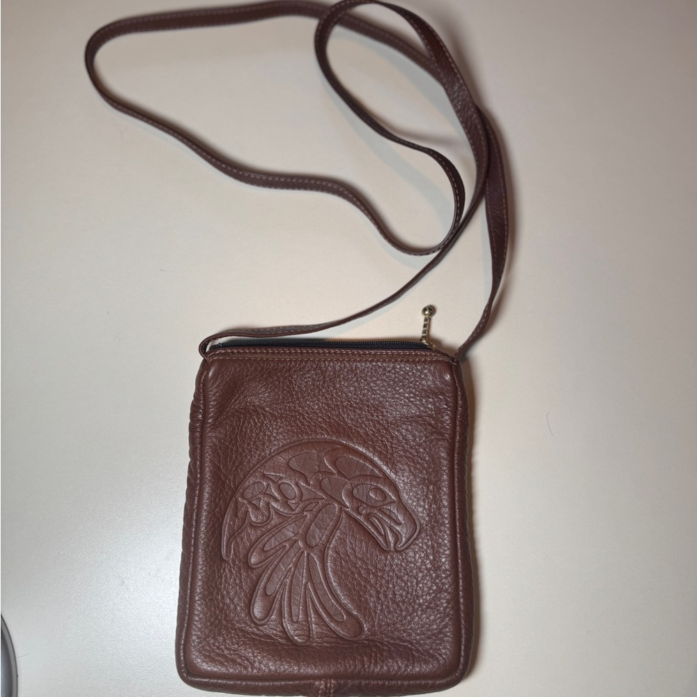 Spirit of the Wild of Canada Leather Crossbody Mini Bag. Eagle/falcon Embossed